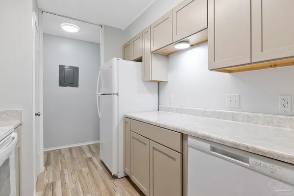 a kitchen with a sink and refrigerator