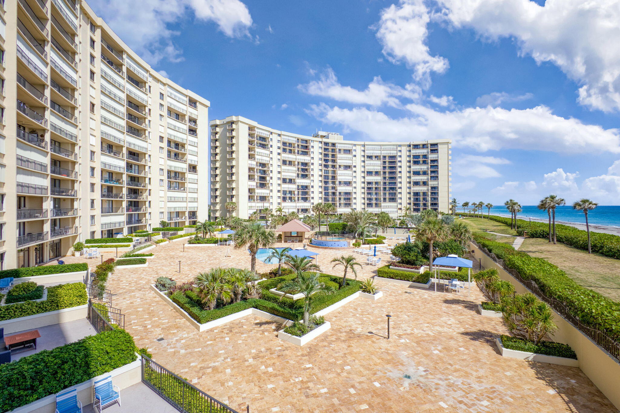 100 Ocean Trail Way, Unit 301 Jupiter, FL 33477 - Photo 21 of 67 a view of swimming pool with outdoor seating and city view