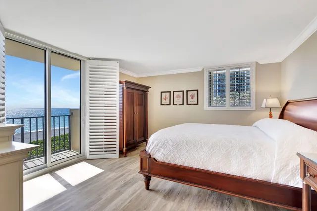 a spacious bathroom with a granite countertop sink mirror and