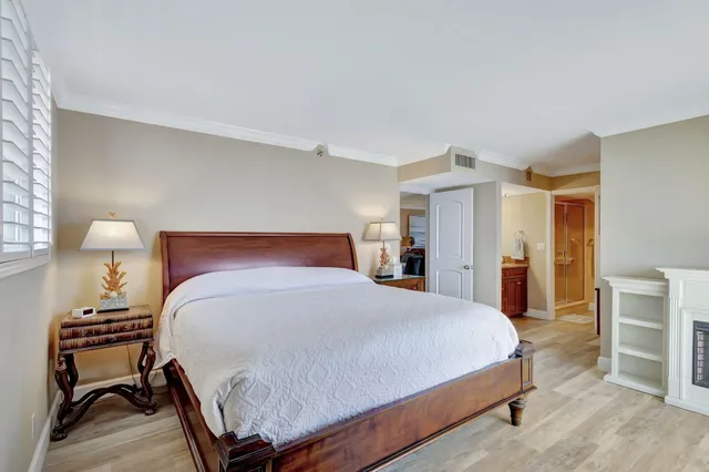 a bathroom with a shower and a glass door