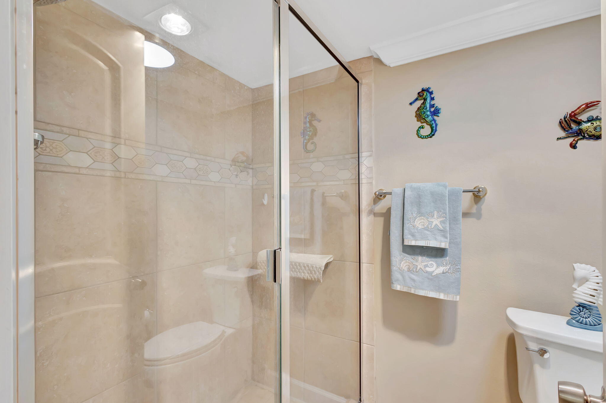 100 Ocean Trail Way, Unit 301 Jupiter, FL 33477 - Photo 28 of 67 a bathroom with a shower and toilet