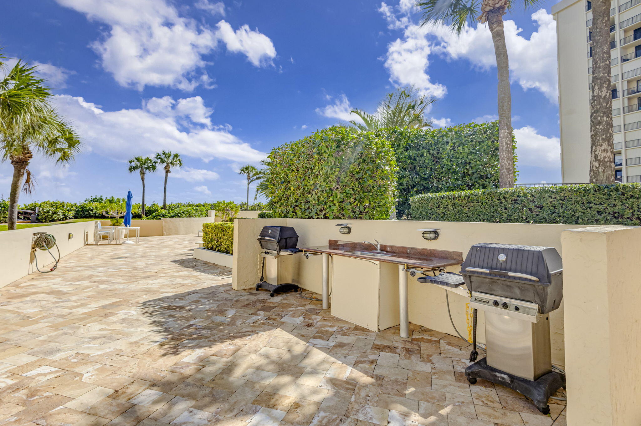 100 Ocean Trail Way, Unit 301 Jupiter, FL 33477 - Photo 45 of 67 a view of a backyard with sitting area