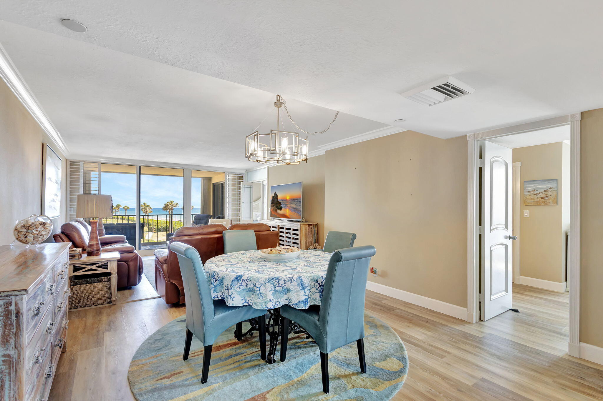 100 Ocean Trail Way, Unit 301 Jupiter, FL 33477 - Photo 8 of 67 a view of a dining room with furniture window and wooden floor
