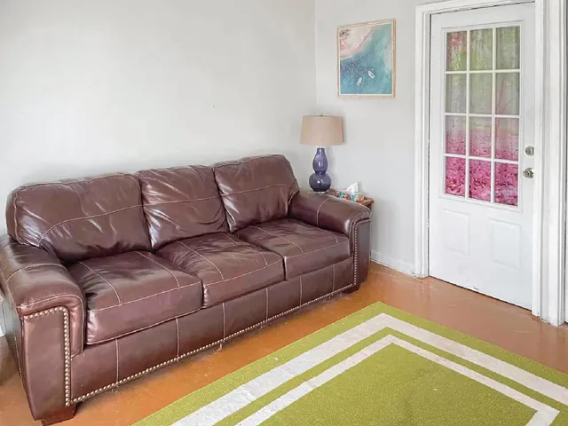 a living room with furniture and a rug
