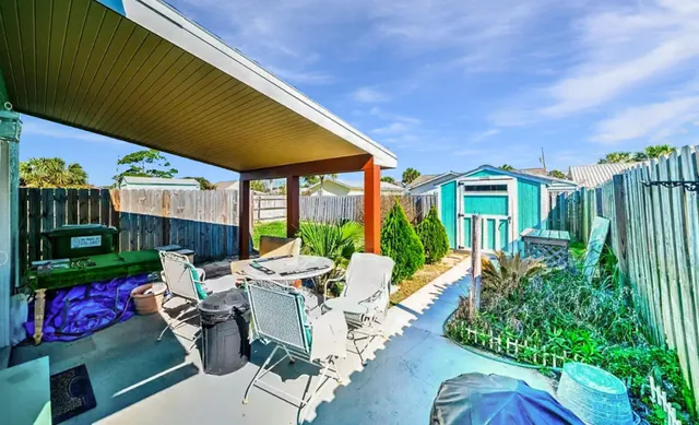 a view of yard with patio