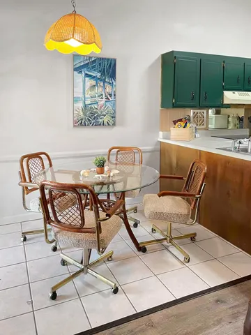 a work place with furniture and next to a window