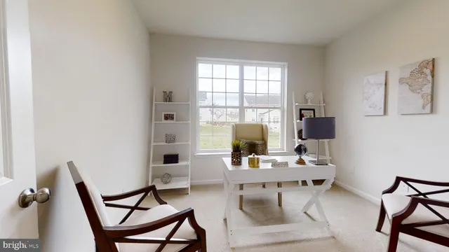 a workspace with furniture and a window