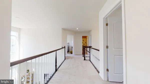 a view of a hallway with a dining room