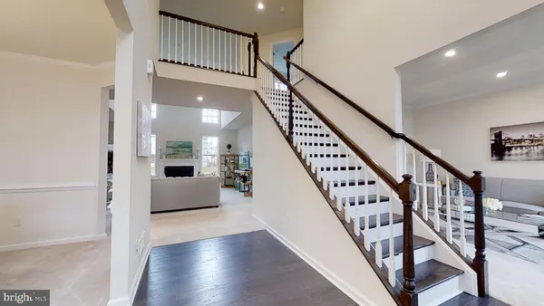 a view of staircase with wooden floor and a potted plant