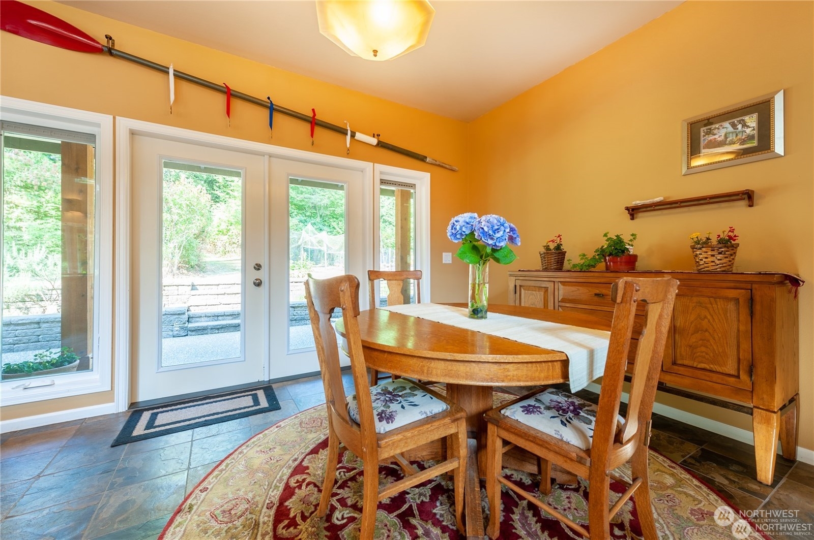 2170 Hilltop Road Lummi Island, WA 98262 - Photo 15 of 31 a view of a dining room with furniture and wooden floor