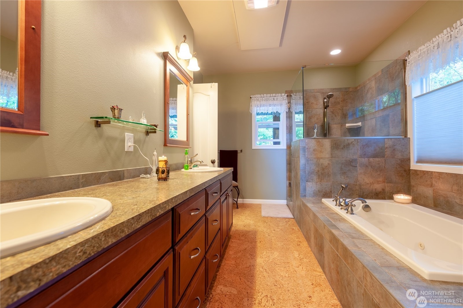 2170 Hilltop Road Lummi Island, WA 98262 - Photo 18 of 31 a spacious bathroom with a granite countertop tub sink and mirror