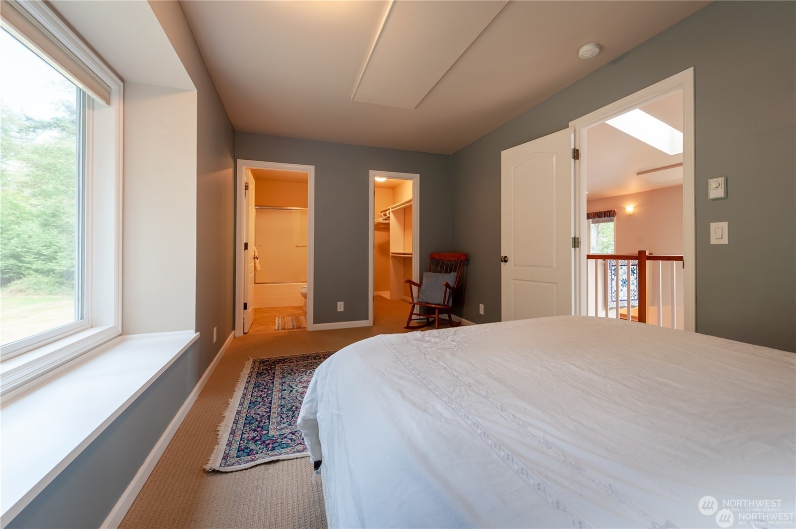 2170 Hilltop Road Lummi Island, WA 98262 - Photo 21 of 31 a bedroom with a bed and a large window with outer view