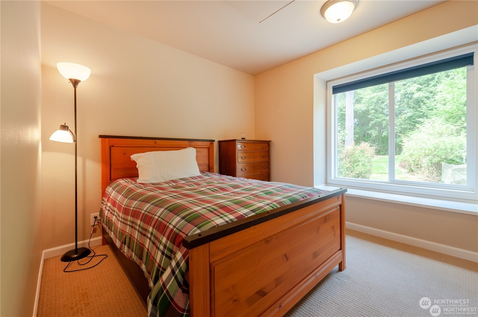 2170 Hilltop Road Lummi Island, WA 98262 - Photo 22 of 31 a bedroom with a bed and window