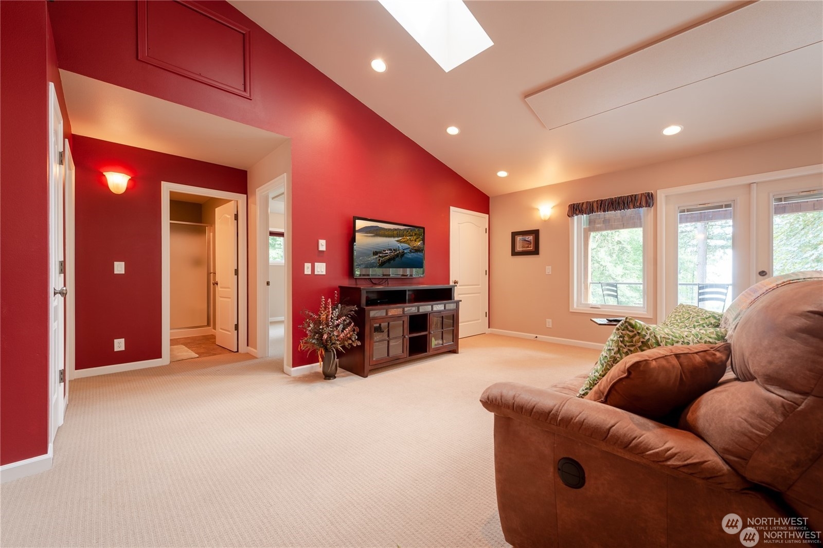 2170 Hilltop Road Lummi Island, WA 98262 - Photo 23 of 31 a living room with furniture and a flat screen tv