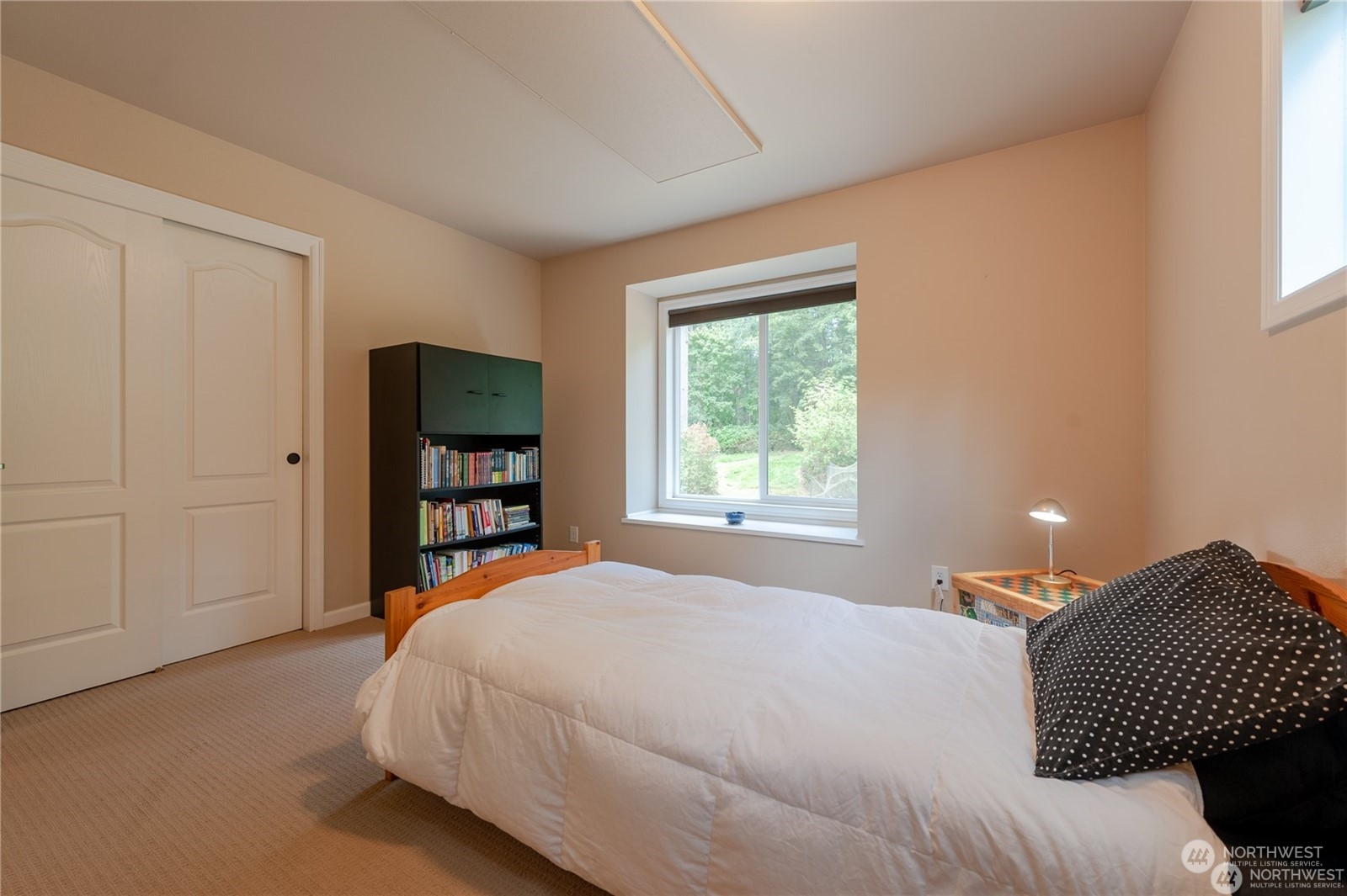 2170 Hilltop Road Lummi Island, WA 98262 - Photo 25 of 31 a bedroom with a bed and a window