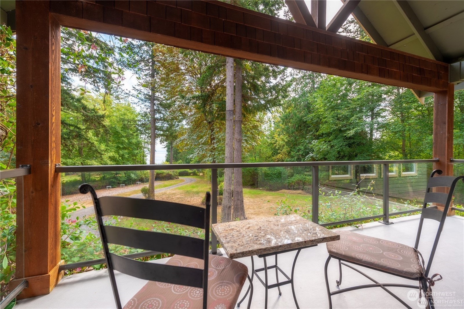 2170 Hilltop Road Lummi Island, WA 98262 - Photo 27 of 31 a view of a porch with furniture and wooden floor