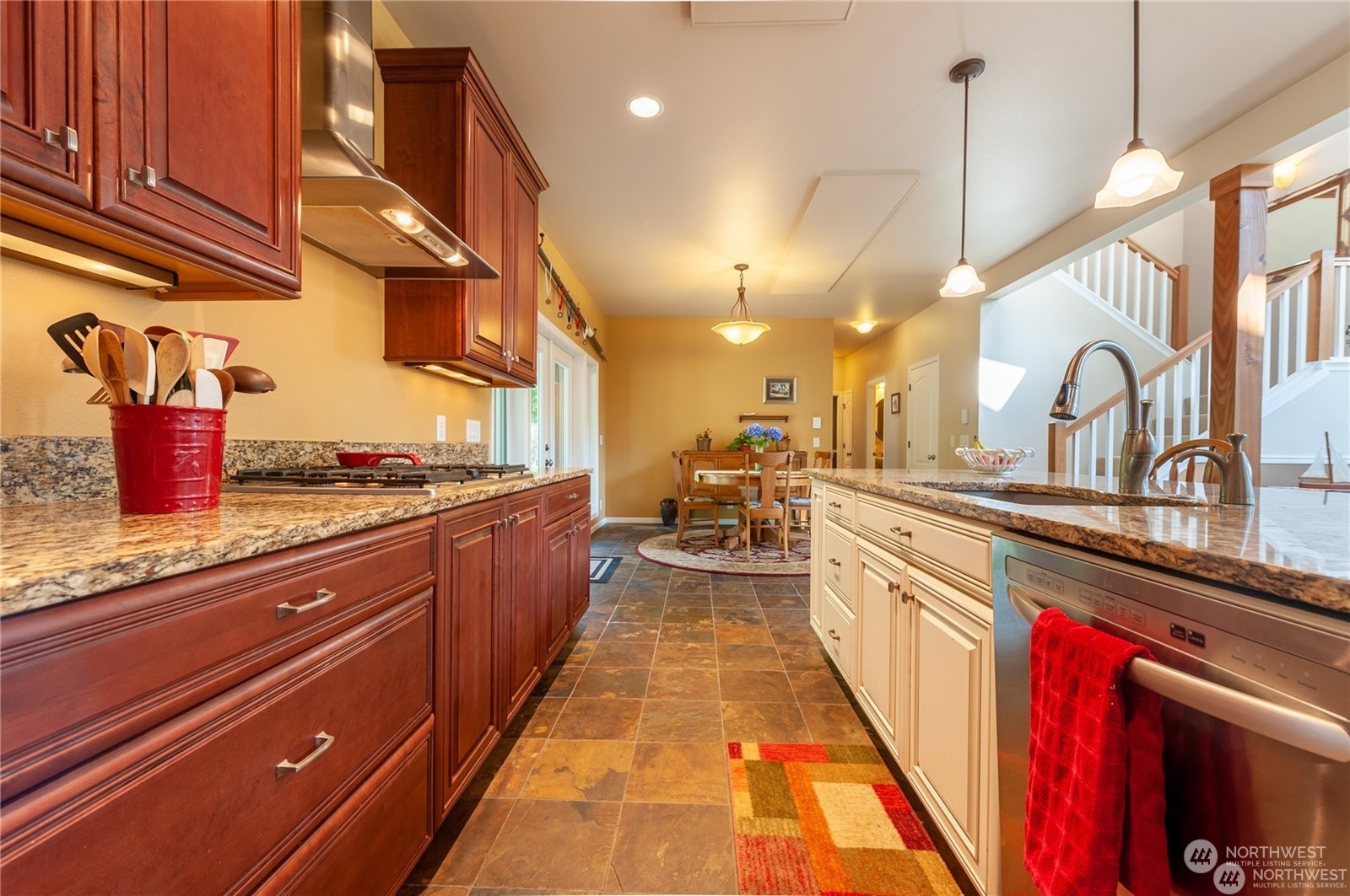 2170 Hilltop Road Lummi Island, WA 98262 - Photo 8 of 31 a large kitchen with stainless steel appliances lots of counter space and a sink