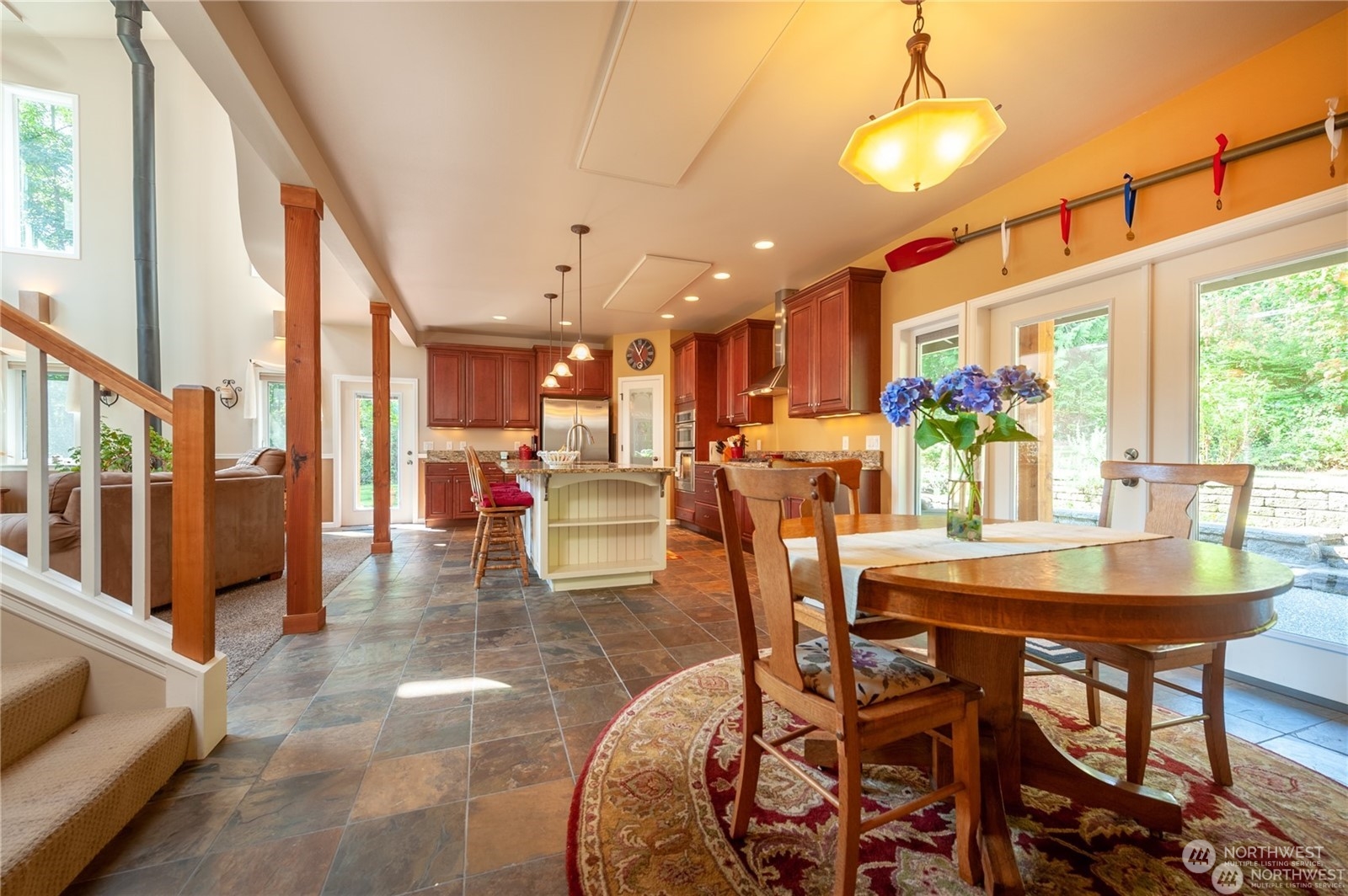 2170 Hilltop Road Lummi Island, WA 98262 - Photo 9 of 31 a view of a dining room with furniture wooden floor and chandelier