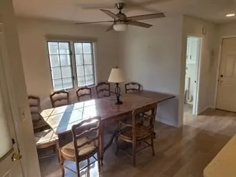 a view of a dining room with furniture and window
