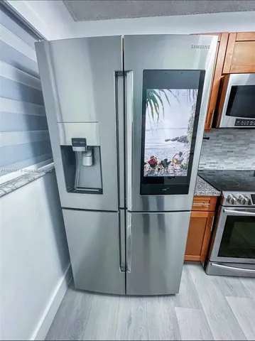 a view of entry way with wooden floor