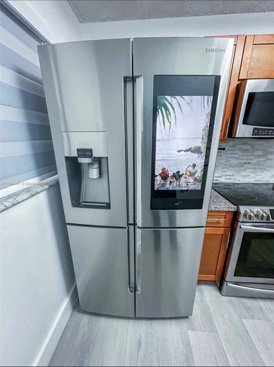 2301 West 60th Street, Unit A211 Hialeah, FL 33016 - Photo 15 of 29 a view of entry way with wooden floor