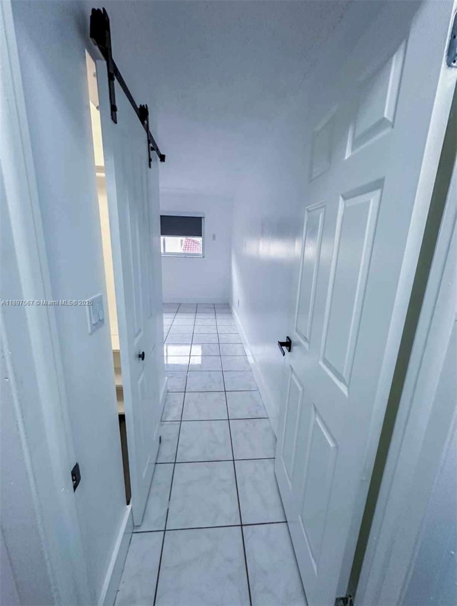 2301 West 60th Street, Unit A211 Hialeah, FL 33016 - Photo 24 of 29 a view of a hallway