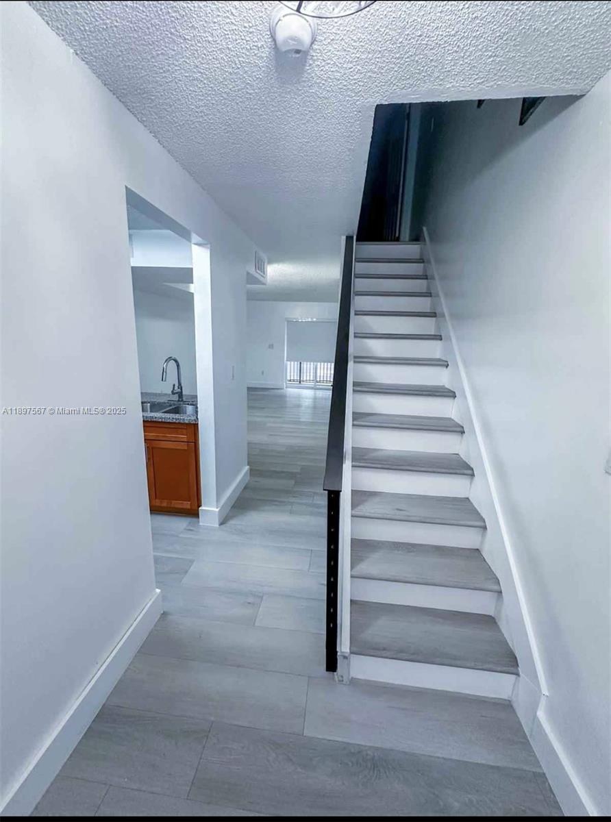 2301 West 60th Street, Unit A211 Hialeah, FL 33016 - Photo 5 of 29 a view of entryway