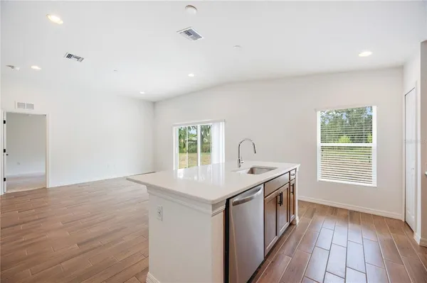 a kitchen that has a sink and a stove