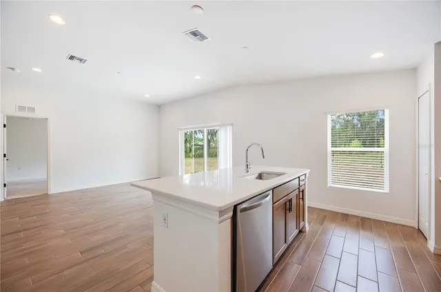 a kitchen that has a sink and a stove