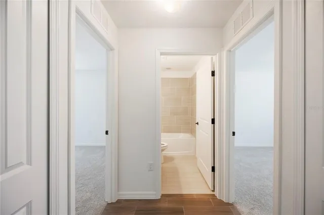 a view of a bathroom with a glass door shower