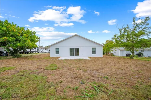 a house view with a backyard space