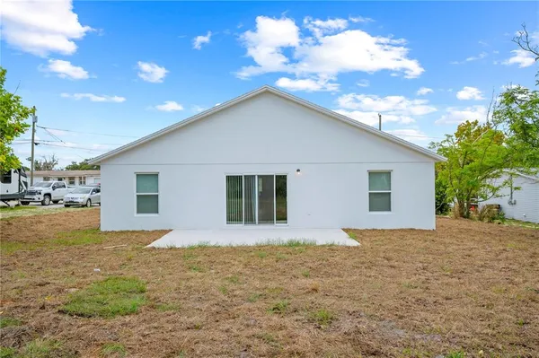 a house that has a tree in front of it