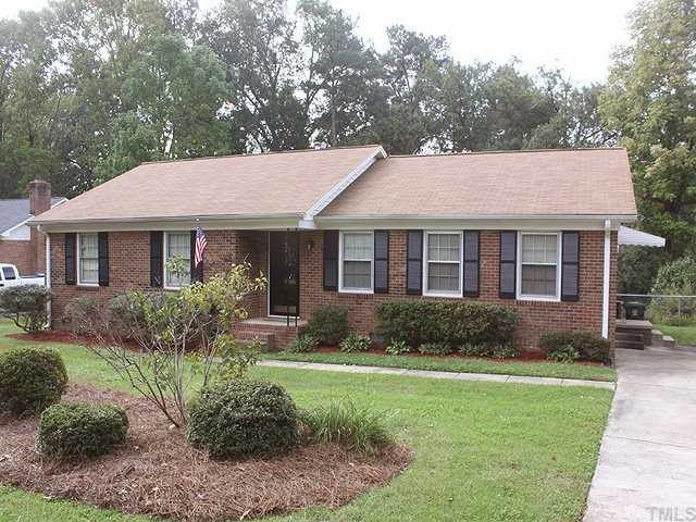 3525 Morningside Drive Raleigh, NC 27607 - Photo 1 of 12 a view of a house with a yard and potted plants