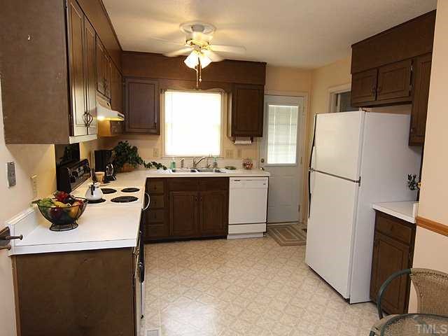 3525 Morningside Drive Raleigh, NC 27607 - Photo 4 of 12 a kitchen with a sink appliances and cabinets
