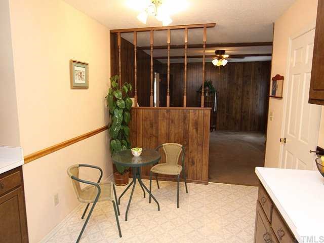 3525 Morningside Drive Raleigh, NC 27607 - Photo 5 of 12 a view of balcony with furniture and wooden floor