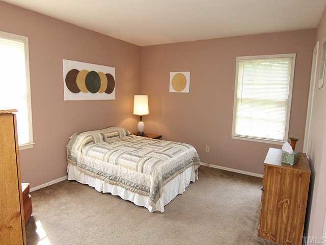 3525 Morningside Drive Raleigh, NC 27607 - Photo 7 of 12 a bedroom with a bed and a window