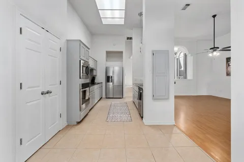 a view of a dining room with furniture and chandelier