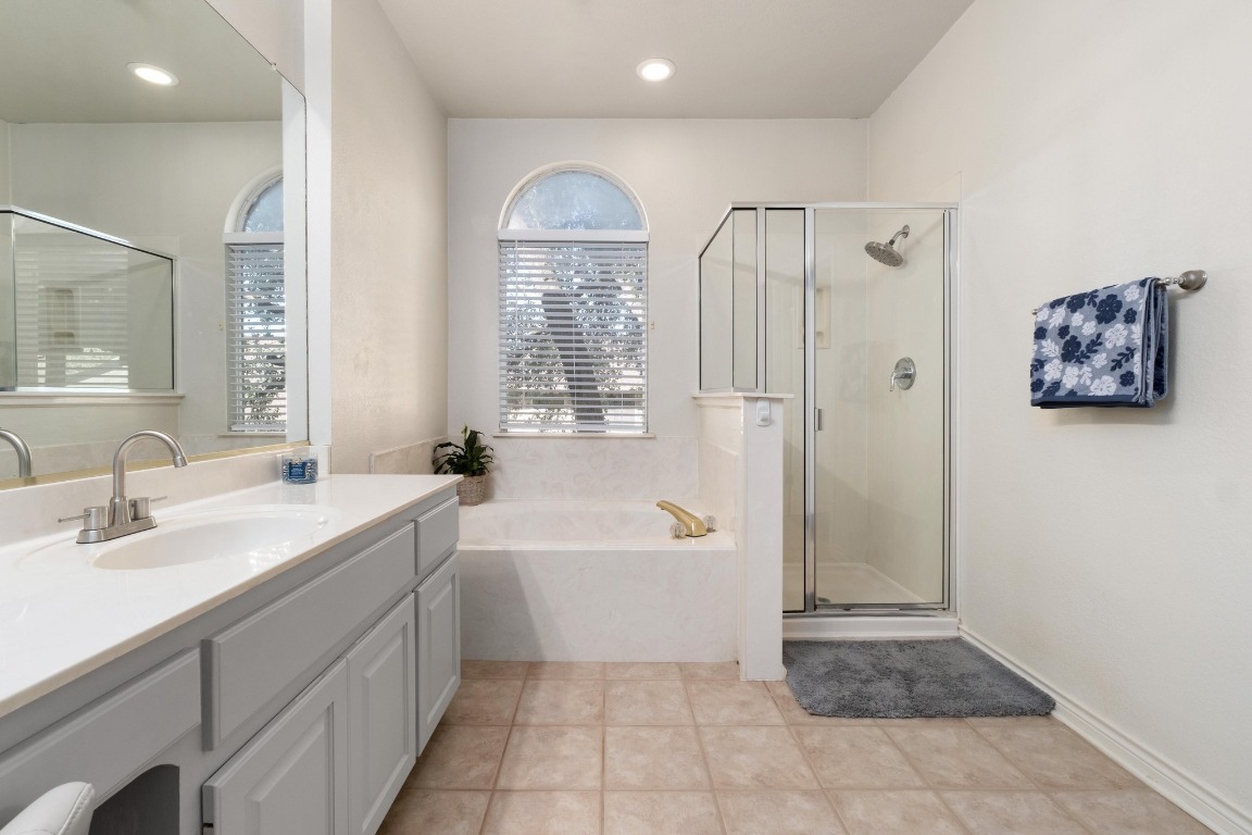 3808 Latimer Drive Austin, TX 78732 - Photo 21 of 31 a bathroom with a tub sink and mirror