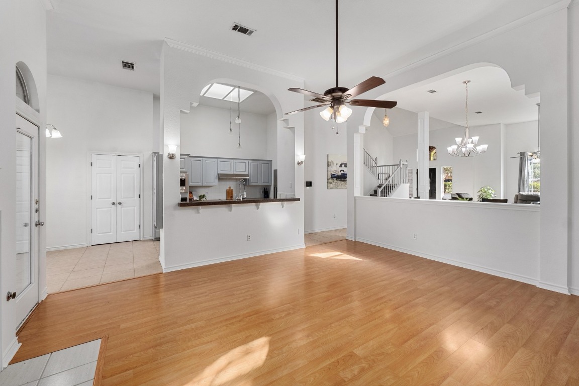 3808 Latimer Drive Austin, TX 78732 - Photo 7 of 31 a view of a kitchen with a refrigerator and a sink