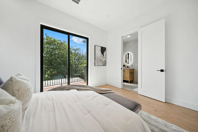 a bathroom with a sink mirror and vanity
