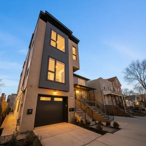 a front view of a house with large windows