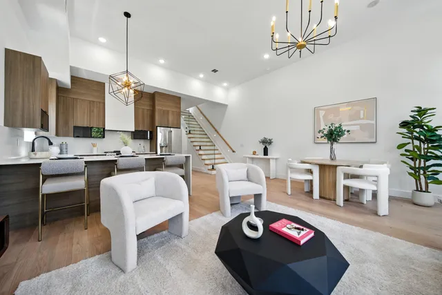 a kitchen with stainless steel appliances a sink stove and cabinets
