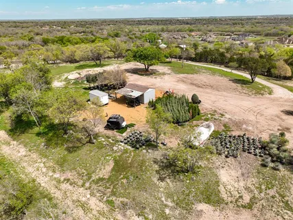 a view of a lake with beach and mountain view