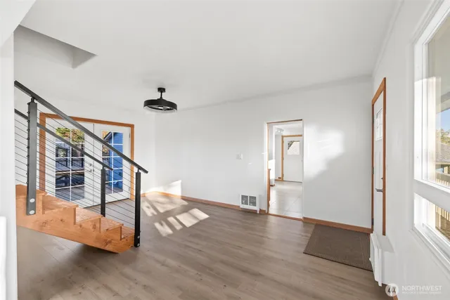 a view of an entryway with wooden floor
