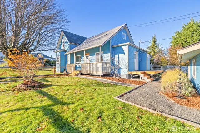 a view of a house with a yard patio and sitting area