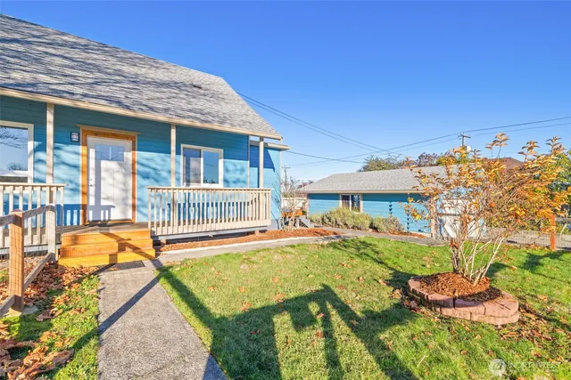 front view of a house with a yard