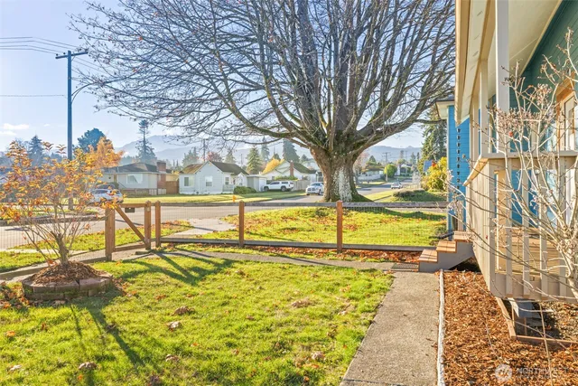 a view of swimming pool with outdoor seating and yard