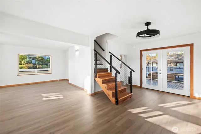 a view of an entryway with wooden floor