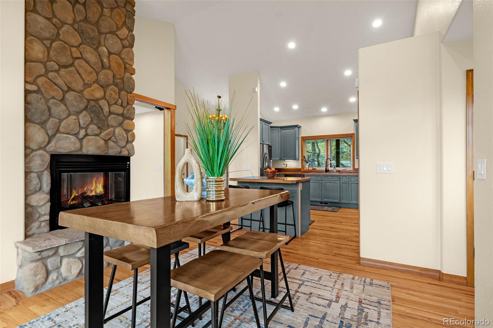 25 Leaming Road Colorado Springs, CO 80906 - Photo 19 of 48 a dining room with furniture and wooden floor