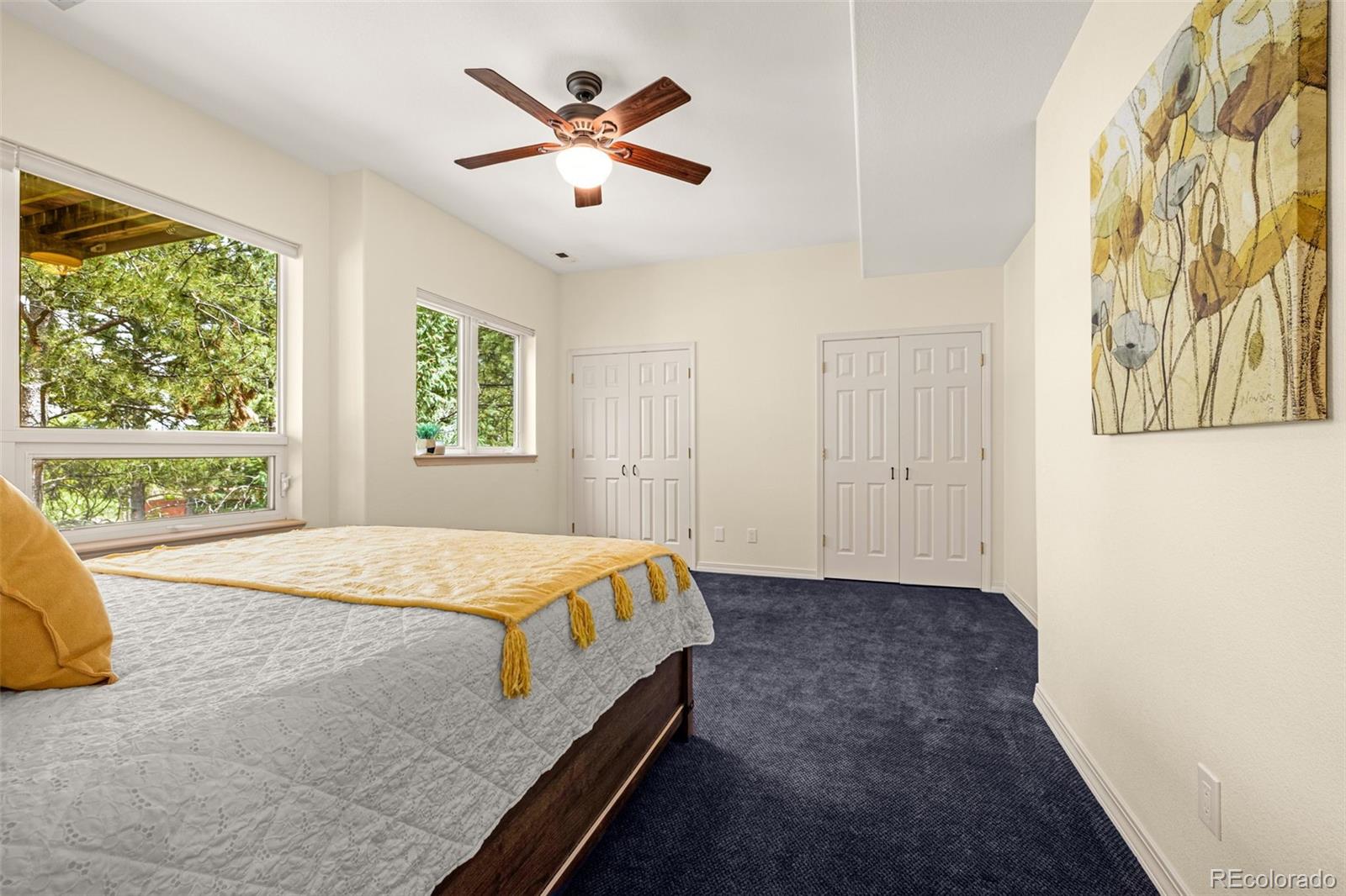 25 Leaming Road Colorado Springs, CO 80906 - Photo 32 of 48 a bedroom with a large bed and a window